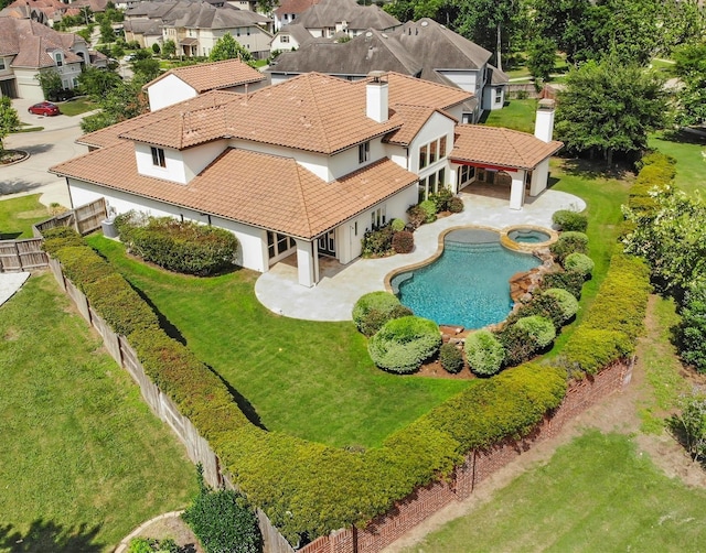 birds eye view of property with a residential view