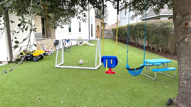 view of jungle gym with fence