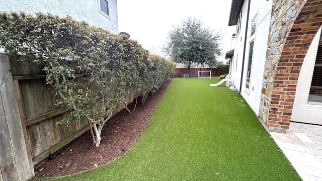 view of yard featuring a fenced backyard