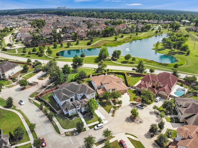 birds eye view of property with a water view and a residential view