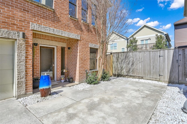 view of patio featuring fence