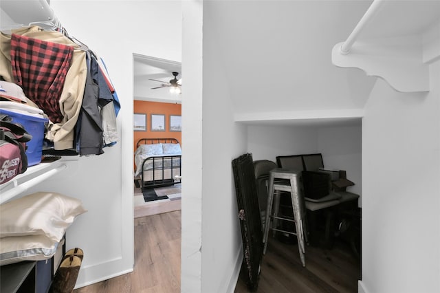 interior space featuring a ceiling fan and wood finished floors