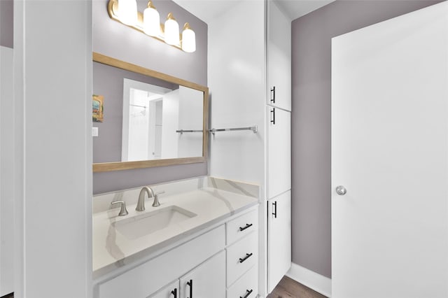 bathroom featuring vanity and baseboards