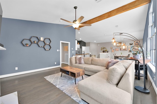 living room featuring visible vents, lofted ceiling with beams, wood finished floors, baseboards, and ceiling fan with notable chandelier