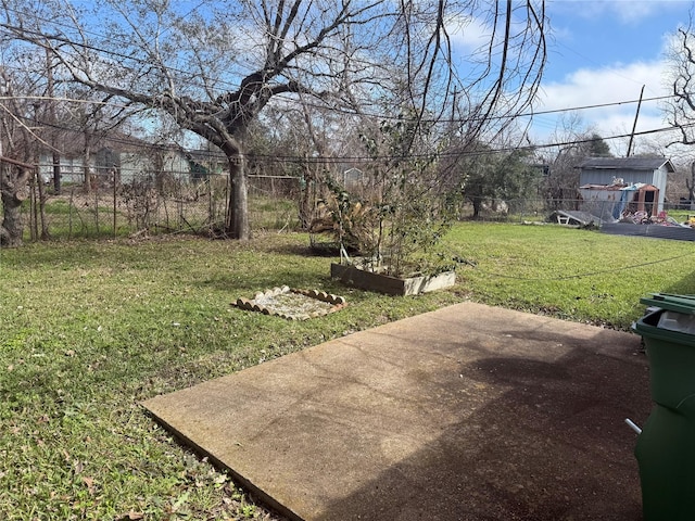 view of yard featuring a patio area and fence