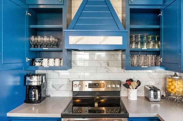 bar featuring premium range hood, decorative backsplash, a dry bar, and stainless steel electric stove