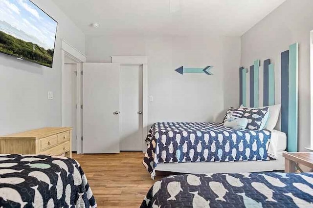 bedroom featuring light wood finished floors