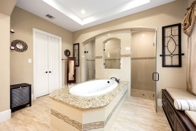 bathroom with recessed lighting, visible vents, a shower stall, baseboards, and a bath