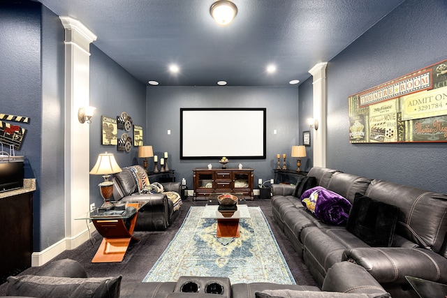 cinema with a textured wall, recessed lighting, decorative columns, and baseboards