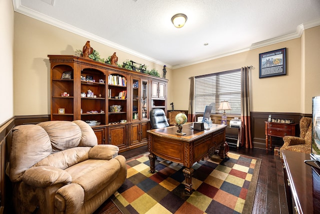 office featuring a wainscoted wall, a textured ceiling, dark wood-style flooring, and crown molding