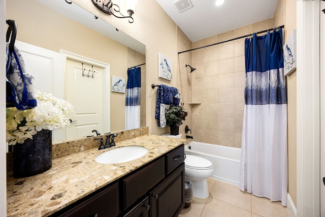 full bath with toilet, tile patterned floors, vanity, visible vents, and shower / tub combo with curtain