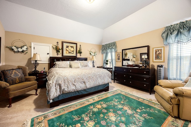 bedroom with light carpet, vaulted ceiling, and a textured ceiling