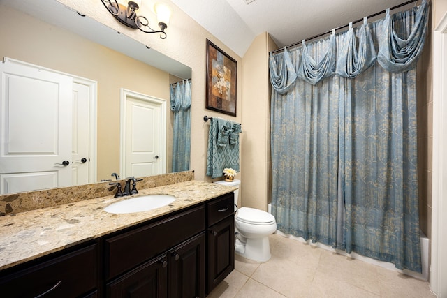 full bathroom featuring tile patterned flooring, shower / tub combo with curtain, vanity, and toilet