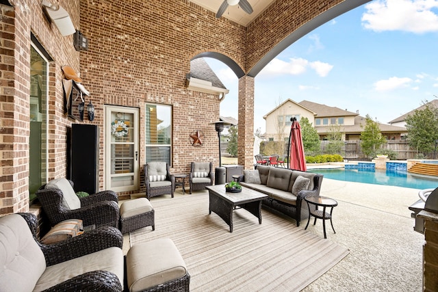 view of patio featuring an outdoor hangout area, ceiling fan, fence private yard, and a fenced in pool