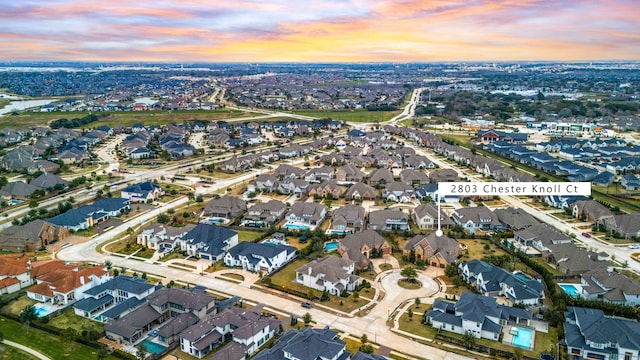 aerial view at dusk with a residential view