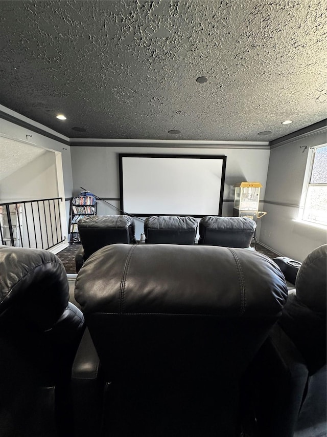 cinema with ornamental molding and a textured ceiling