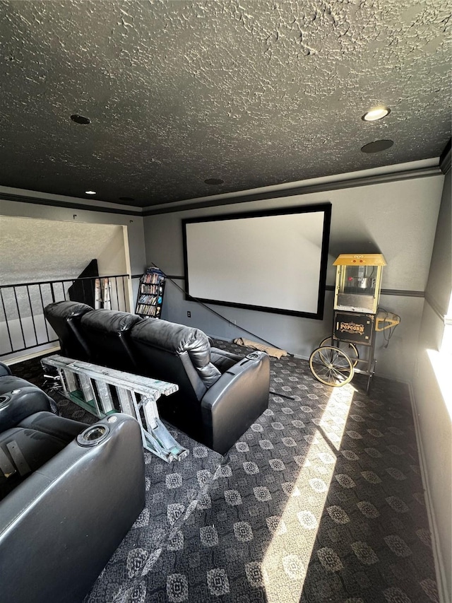 carpeted cinema room featuring a textured ceiling and ornamental molding