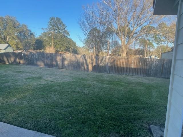 view of yard with a fenced backyard