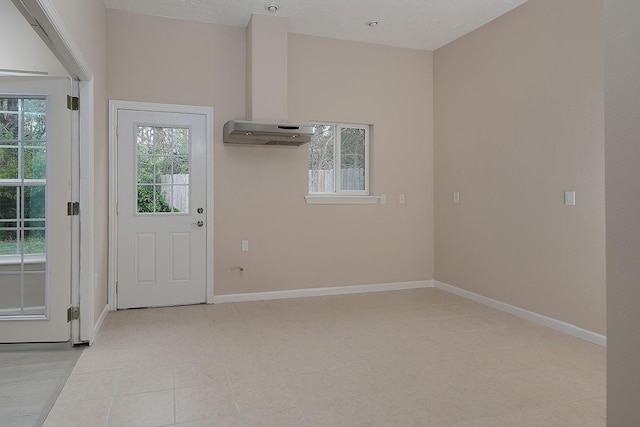 entryway featuring baseboards