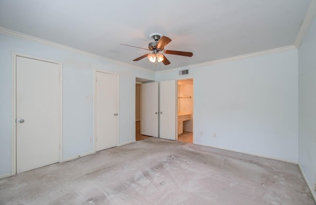 unfurnished bedroom with ensuite bathroom, light carpet, a ceiling fan, visible vents, and ornamental molding