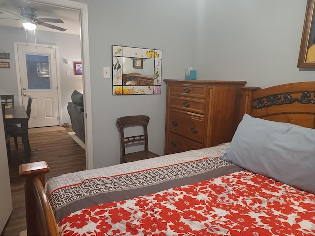 bedroom with dark wood-style flooring