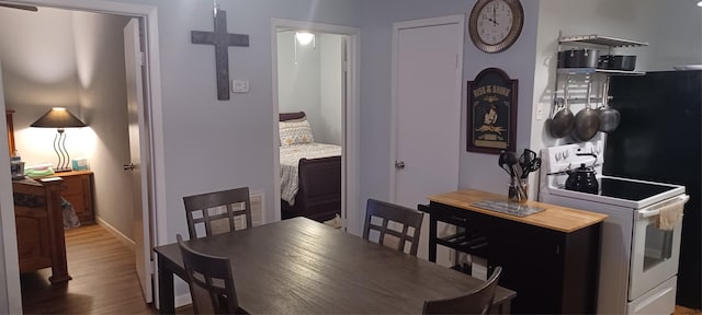 dining room with wood finished floors