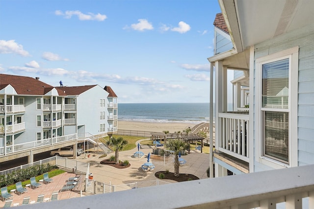 balcony with a view of the beach and a water view