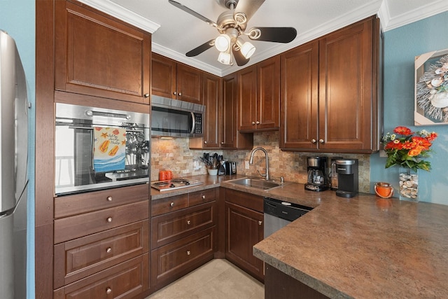 kitchen with crown molding, dark countertops, decorative backsplash, appliances with stainless steel finishes, and a sink