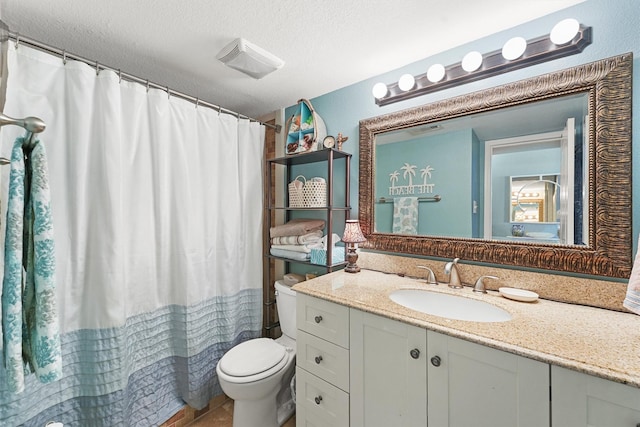 full bathroom with visible vents, a shower with shower curtain, toilet, a textured ceiling, and vanity