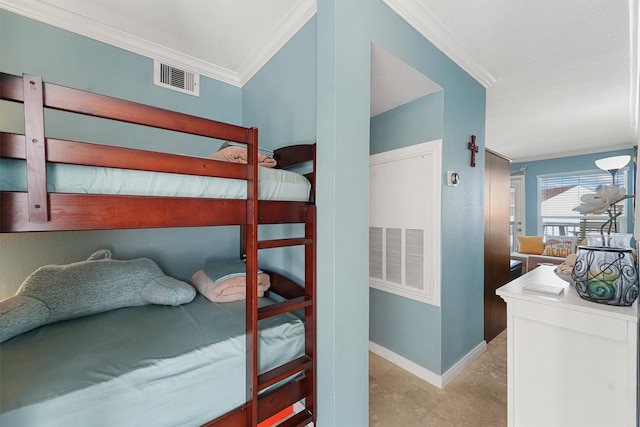 bedroom with ornamental molding, visible vents, and baseboards