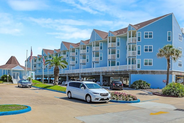 view of property with uncovered parking