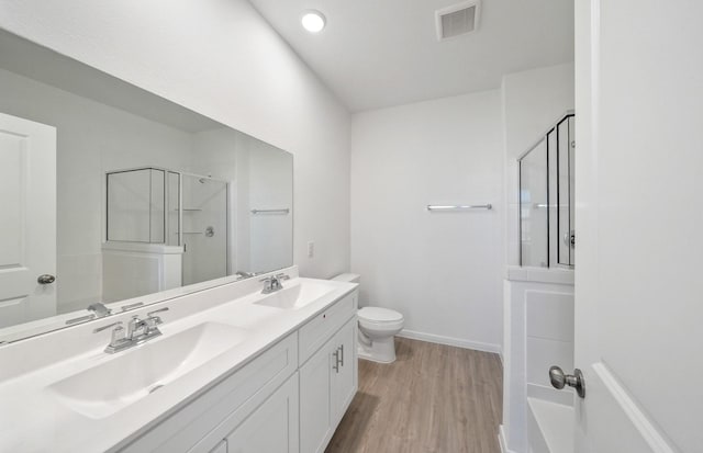 10702 Sora Dr, Willis, TX 77378 - full bath with visible vents, a shower with shower door, and a sink