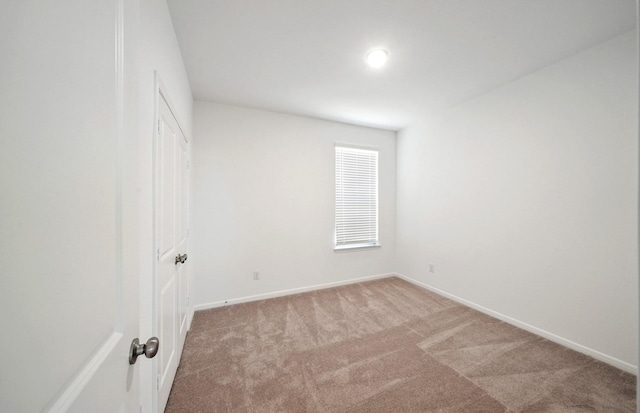 10702 Sora Dr, Willis, TX 77378 - empty room with carpet and baseboards