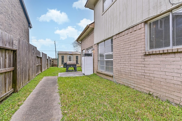 view of yard with a fenced backyard