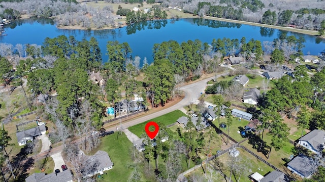 drone / aerial view with a water view and a residential view