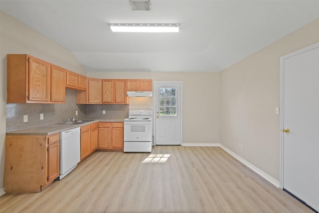 kitchen featuring white appliances, tasteful backsplash, visible vents, light countertops, and under cabinet range hood