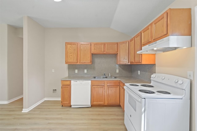 kitchen featuring under cabinet range hood, white appliances, a sink, light countertops, and tasteful backsplash