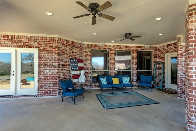 view of patio with ceiling fan and an outdoor living space