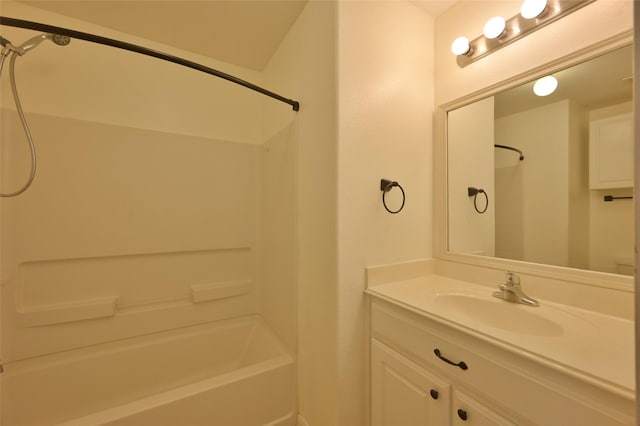 bathroom featuring  shower combination and vanity