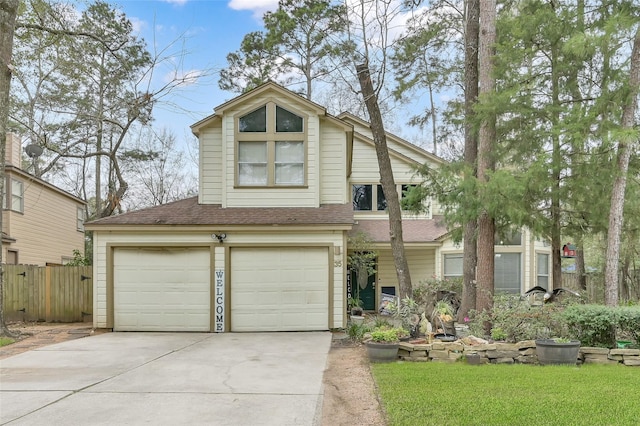 view of front of property with a shingled roof, concrete driveway, fence, and a garage