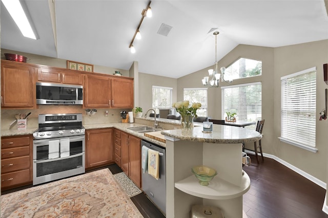 kitchen with lofted ceiling, stainless steel appliances, a sink, open shelves, and brown cabinetry