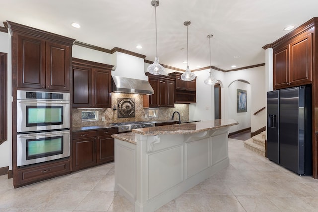 kitchen with arched walkways, tasteful backsplash, black fridge with ice dispenser, double oven, and dark stone countertops