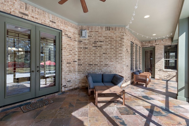 view of patio / terrace with french doors and ceiling fan