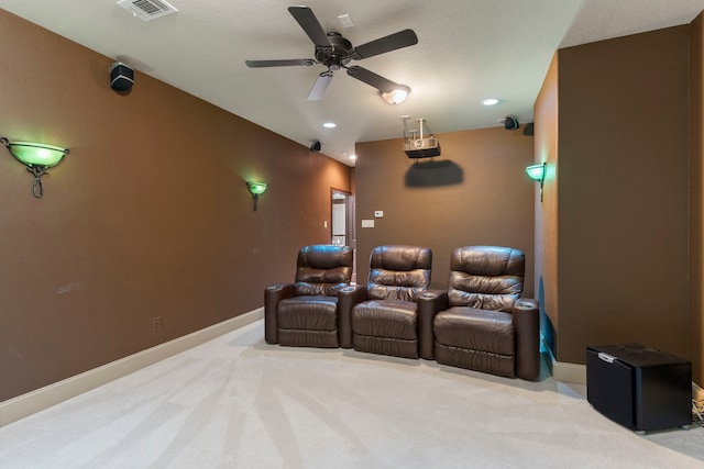 cinema room featuring baseboards, visible vents, light colored carpet, ceiling fan, and recessed lighting