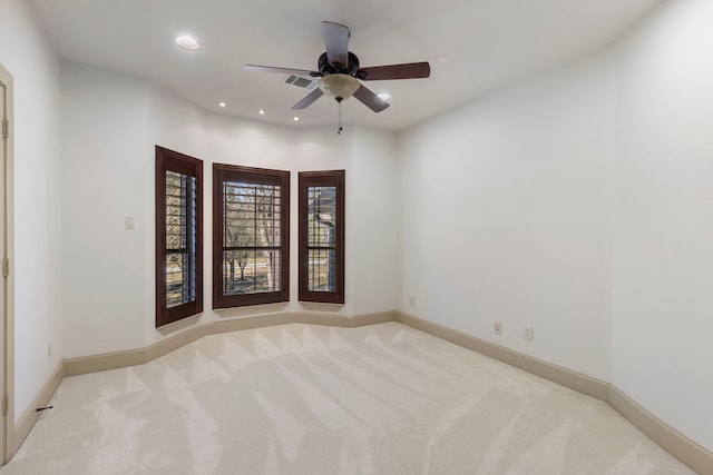 unfurnished room with recessed lighting, visible vents, a ceiling fan, light carpet, and baseboards