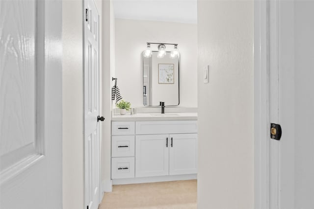 bathroom featuring tile patterned flooring and vanity