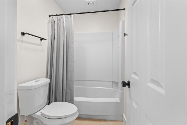 full bathroom with shower / tub combo and toilet