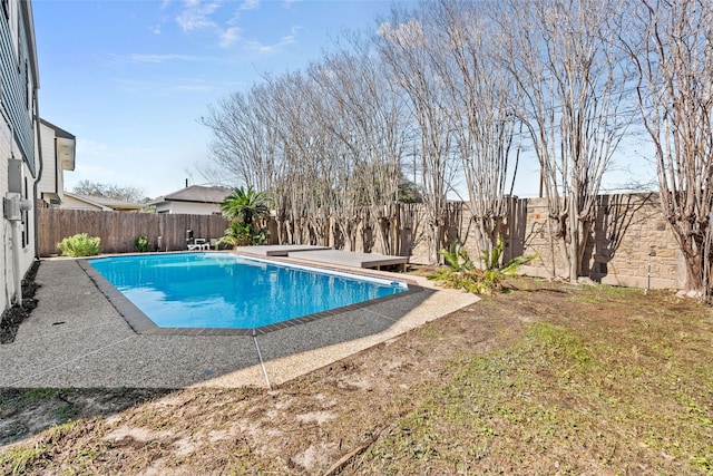 view of swimming pool featuring a fenced backyard and a fenced in pool