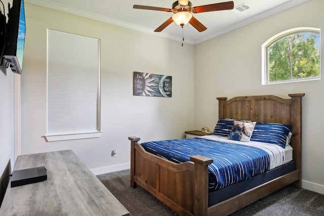 bedroom featuring baseboards, visible vents, dark colored carpet, and crown molding