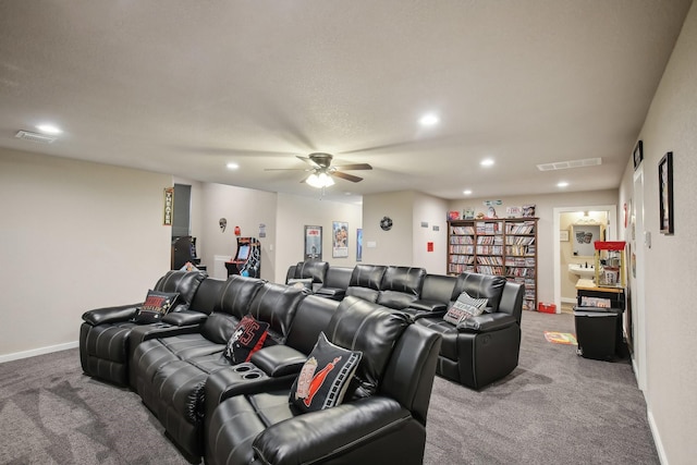 carpeted home theater with a ceiling fan, recessed lighting, visible vents, and baseboards